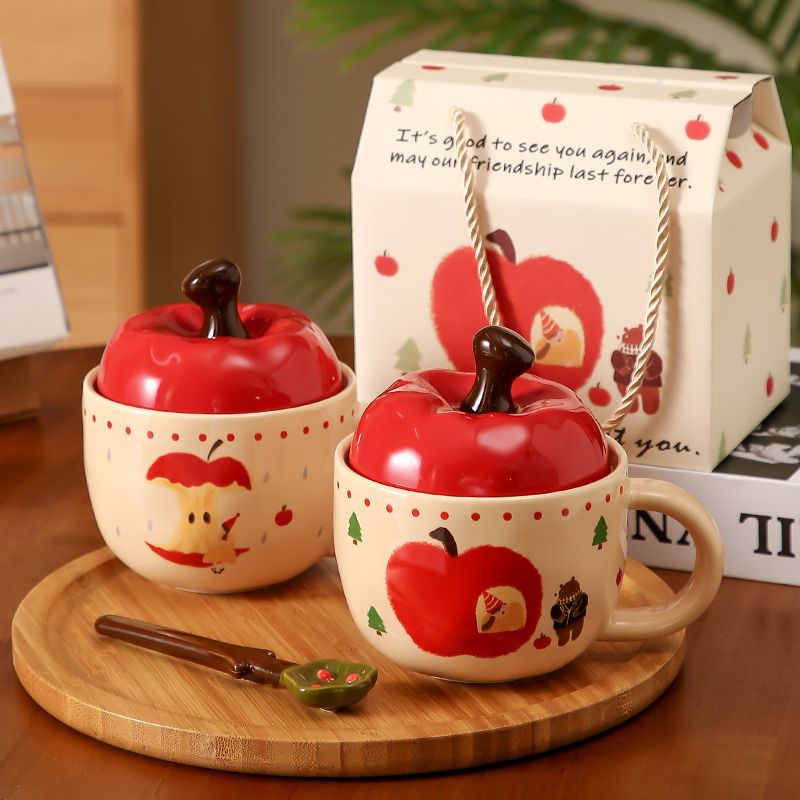 A large apple with a lid in a cup